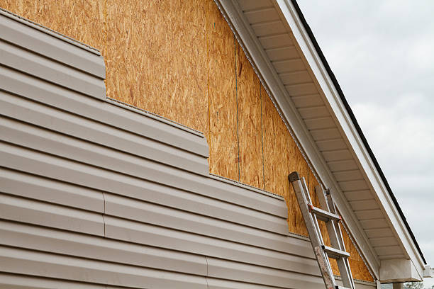 Professional Storm Damage Siding Repair technician working in Poquoson, VA